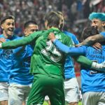 Jugadores de Belgrano festejando un gol en un partido de fútbol